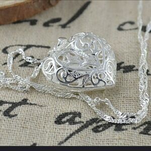 Silver puffy ornate heart necklace